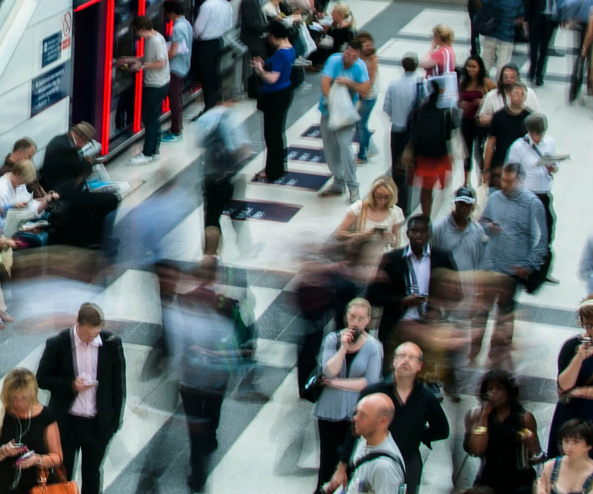 People walking around a large building